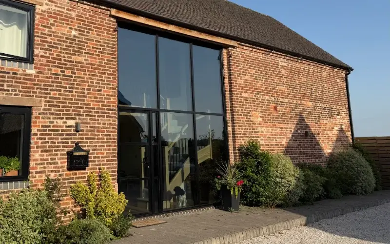 Barn conversion with window film to reduce heat and glare